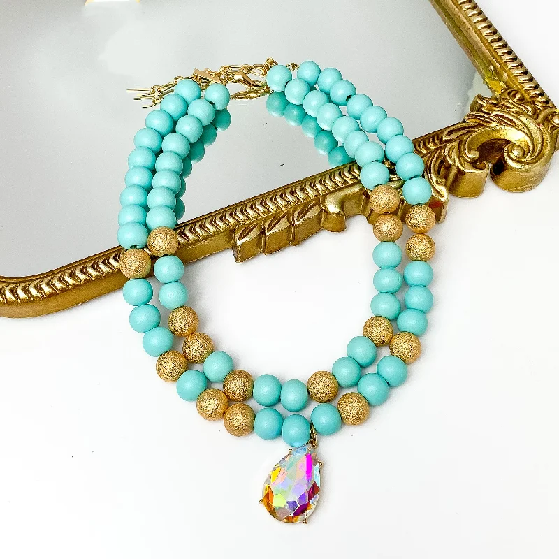 Ripple design necklaces-Pink Panache | Two Strand Turquoise and Gold Tone Beaded Necklace with Large AB Crystal Teardrop