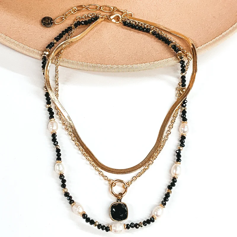 Off-center necklaces-Pink Panache | Three Strand Pearl and Black Beaded Necklace with Gold Chains and Black Cushion Cut Crystal Drop